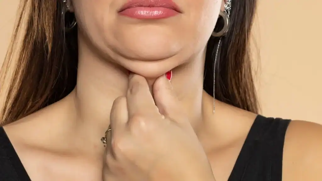 An image of a woman with double chin, sad, worried : Non Surgical Double Chin Removal Treatment in Bordesley, UK